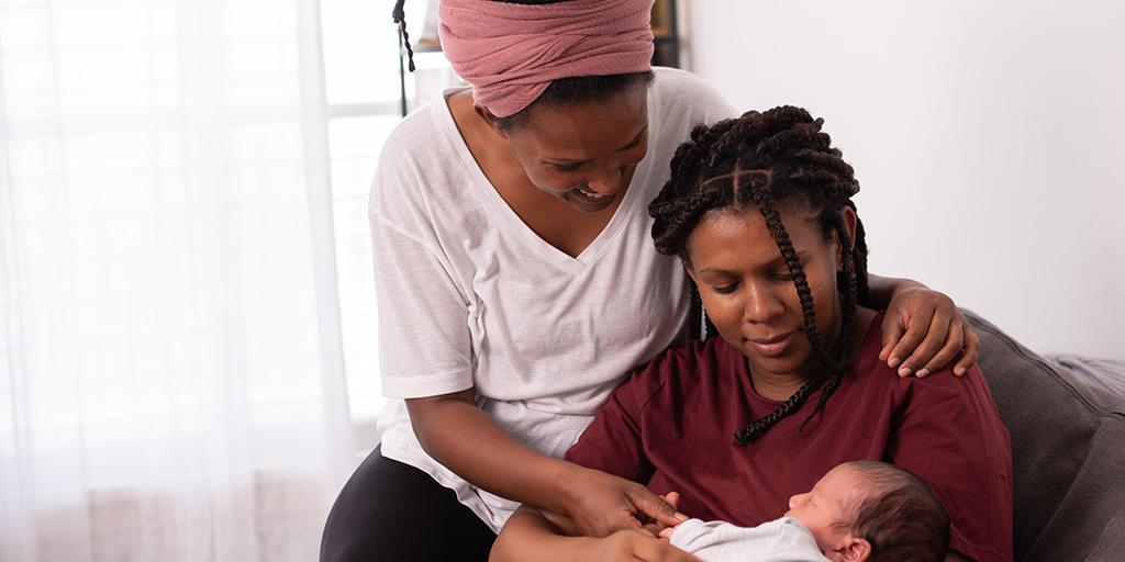 parents hold their child