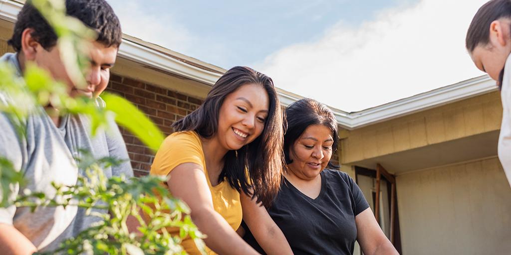 a family works in the garden