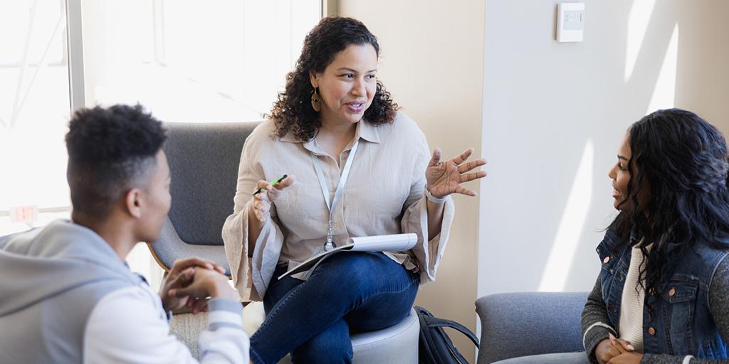 a teacher talks to her students