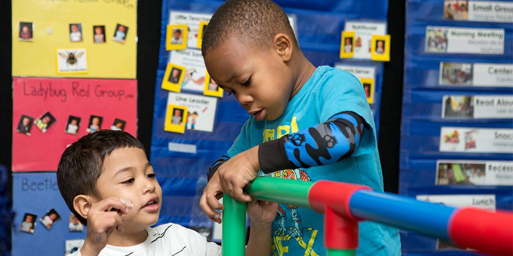 children play with building toys