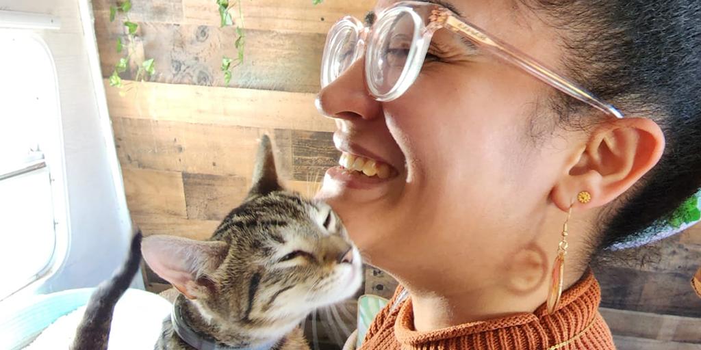 Joselyn holds one of her cats