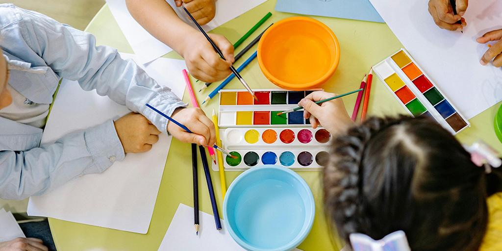 children painting with watercolors